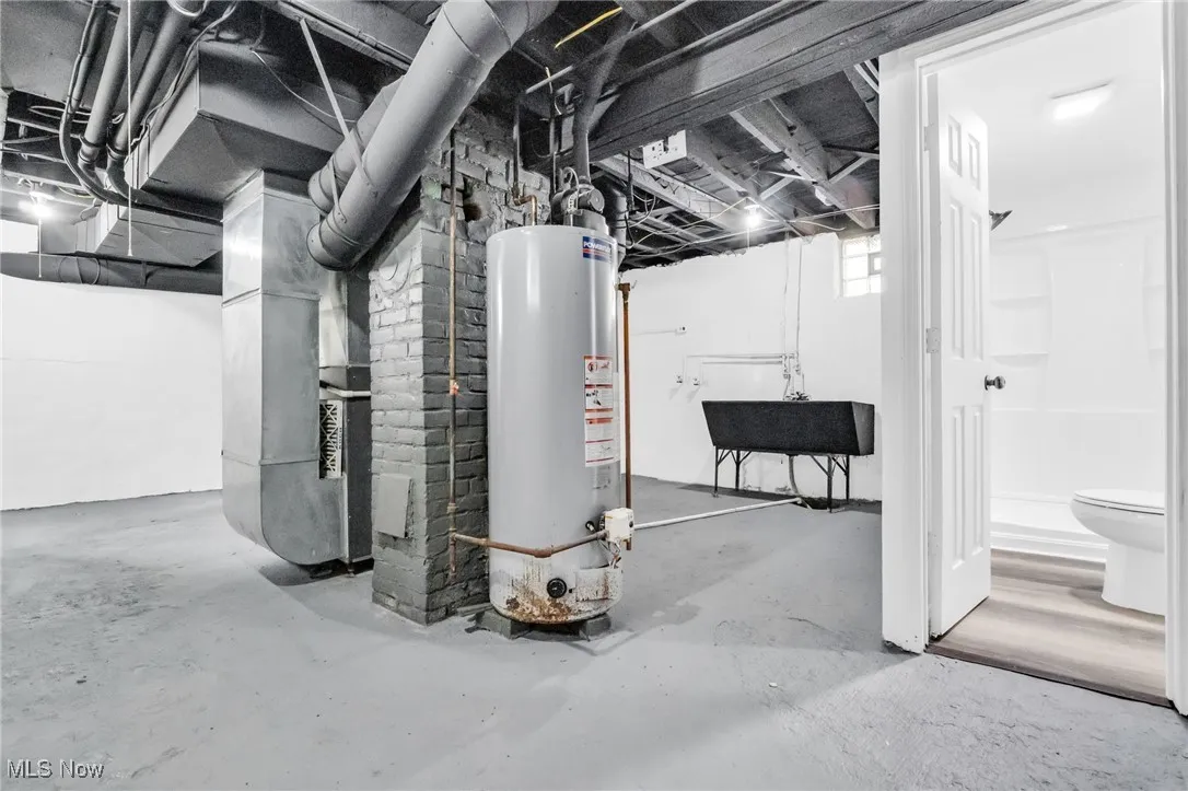 Basement featuring water heater