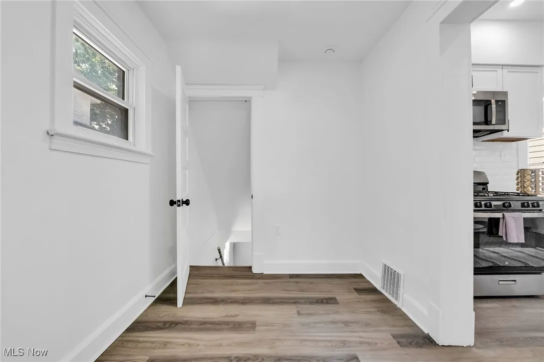 Hallway with wood finished floors