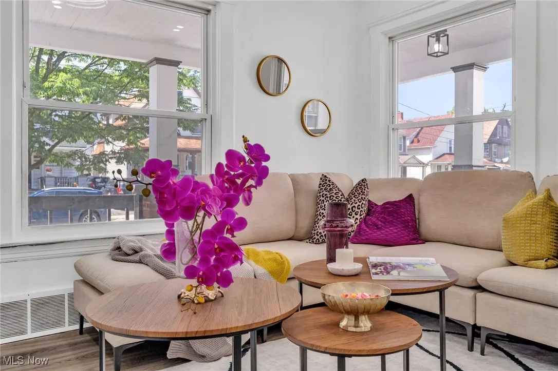 Living room with healthy amount of natural light and wood finished floors