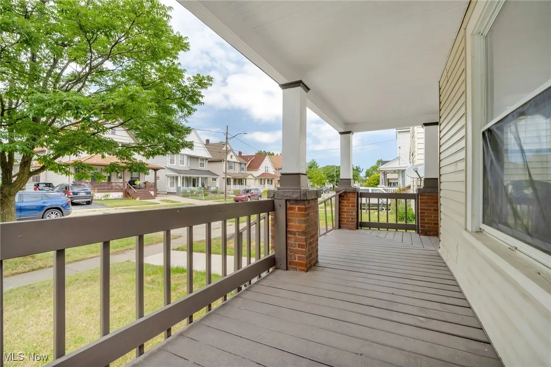 Wooden porch with a residential view