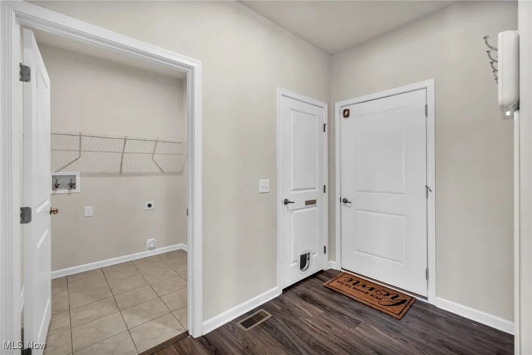 Hallway leading to laundry room and garage