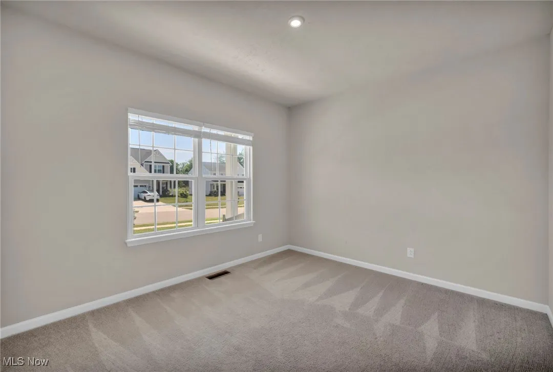 Empty room with carpet floors