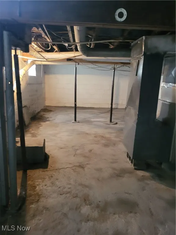 Unfinished below grade area with heating unit