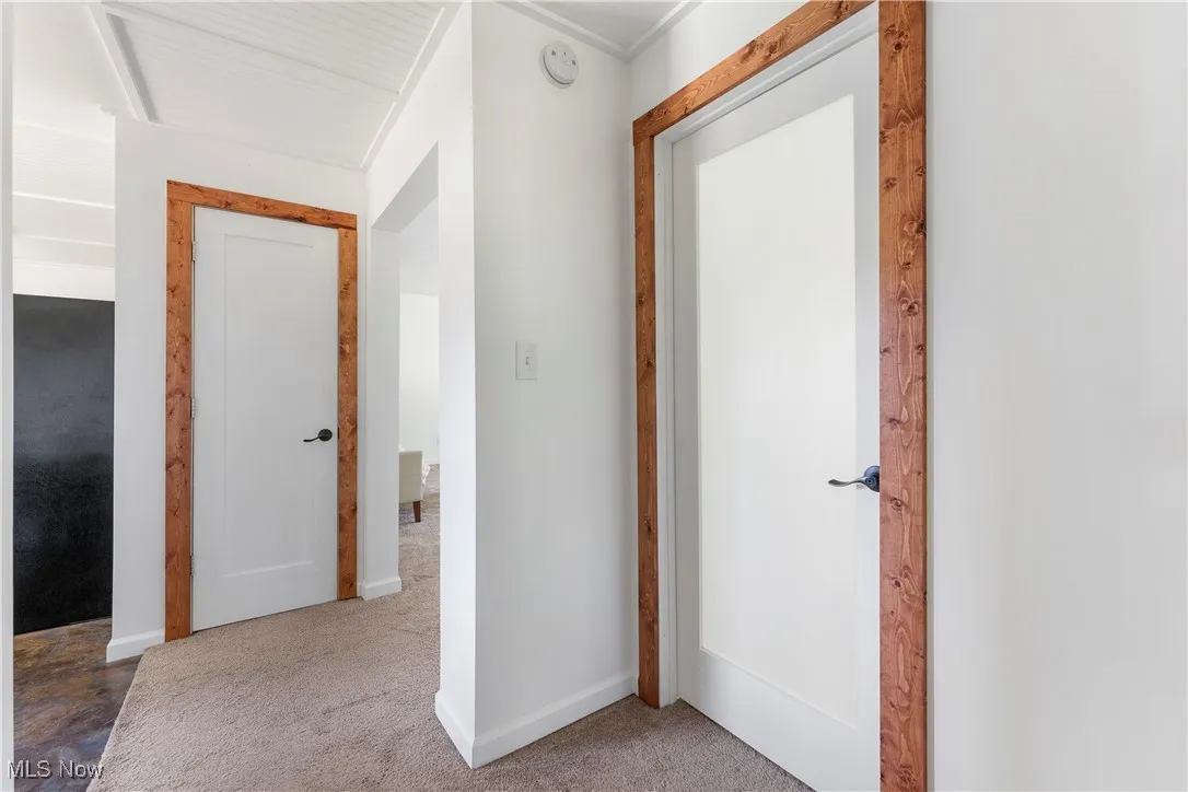 Hallway featuring carpet