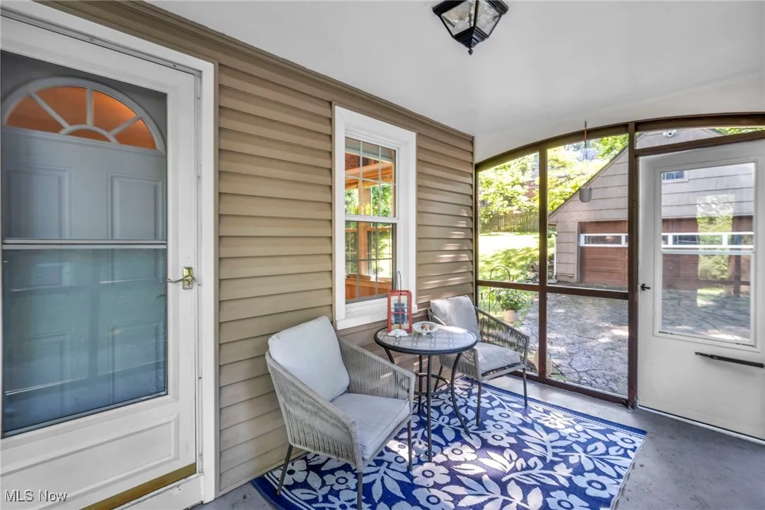 View of cozy attached screened-in porch.
