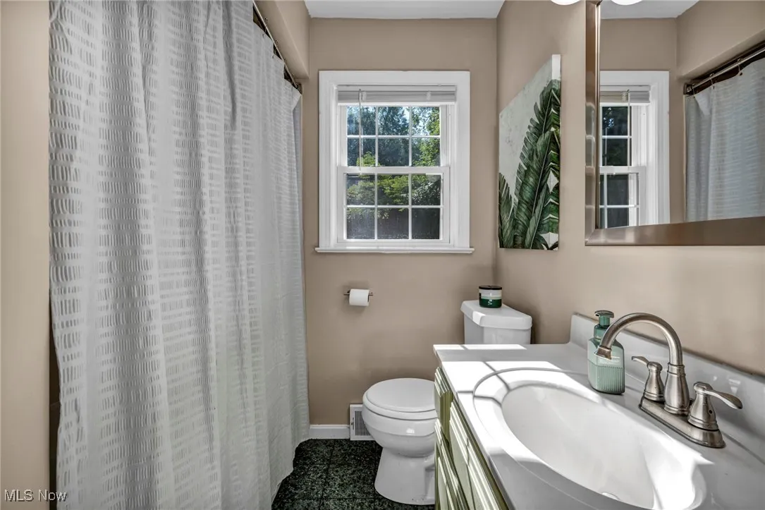 First floor full bathroom view from doorway.