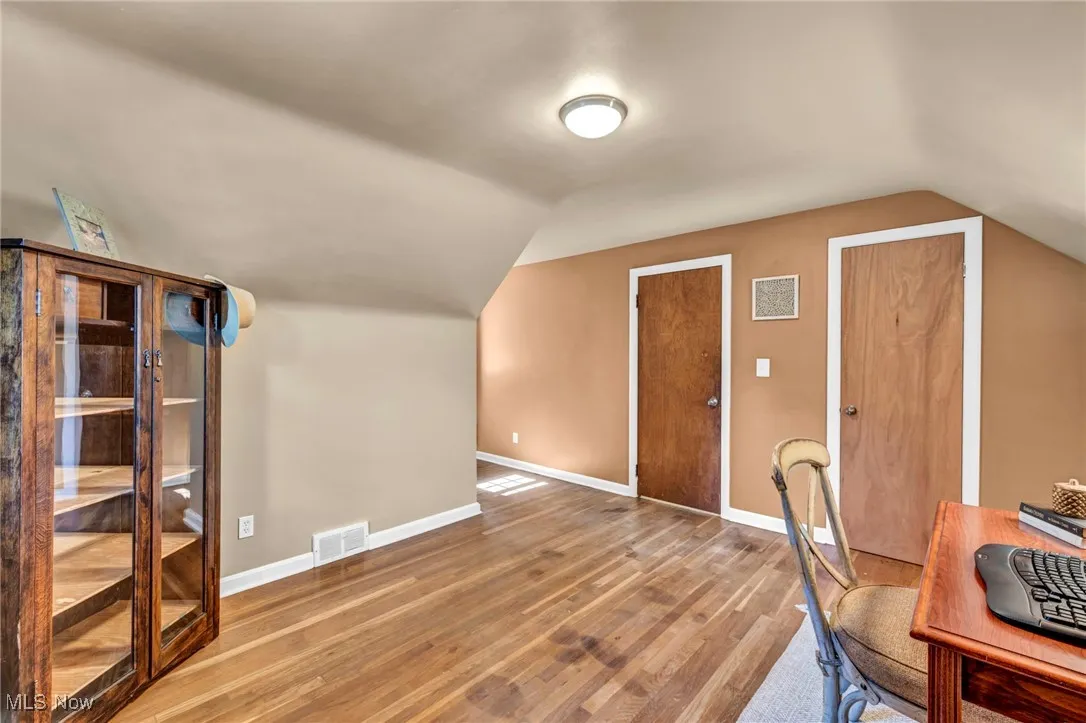Second floor office space or bedroom with vaulted ceiling.