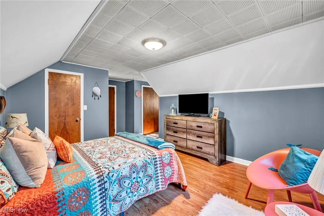 Second floor bedroom showing both closets (one is a full walk-in with wire shelving).