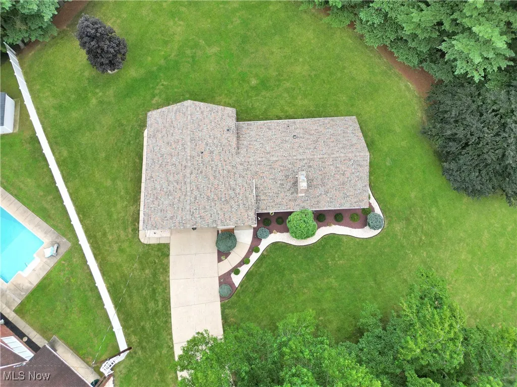 View of subject property with a pool