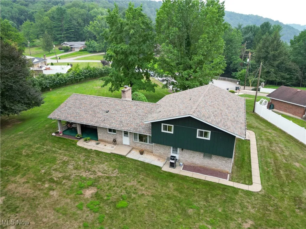 View of subject property featuring a forest