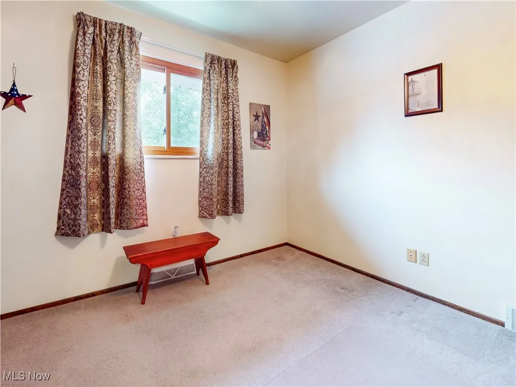 Spare room with carpet flooring and baseboards