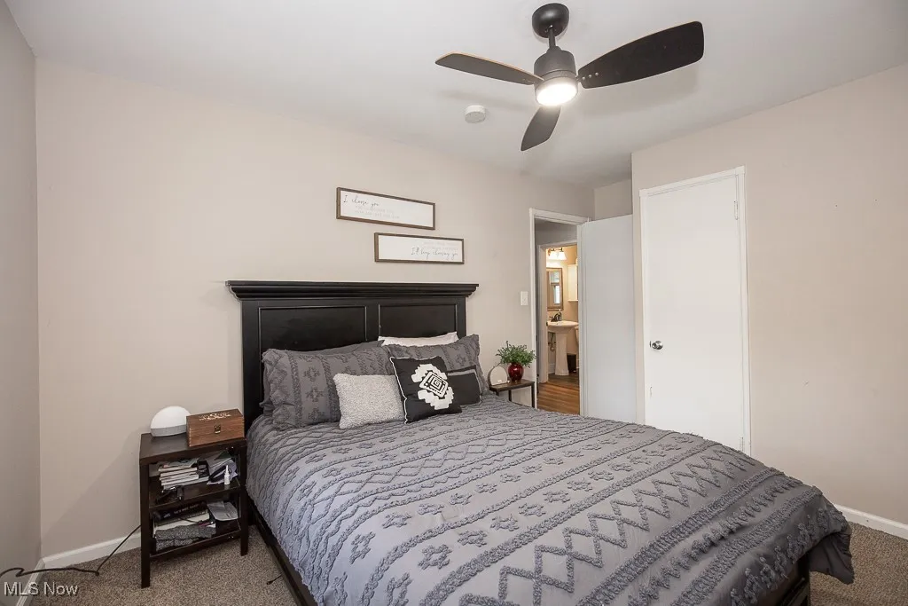 Bedroom with carpet flooring and a ceiling fan