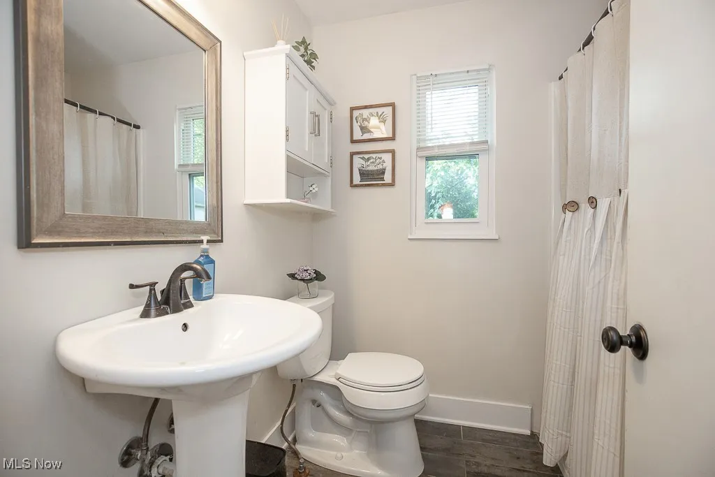 Bathroom featuring plenty of natural light and wood finished floors
