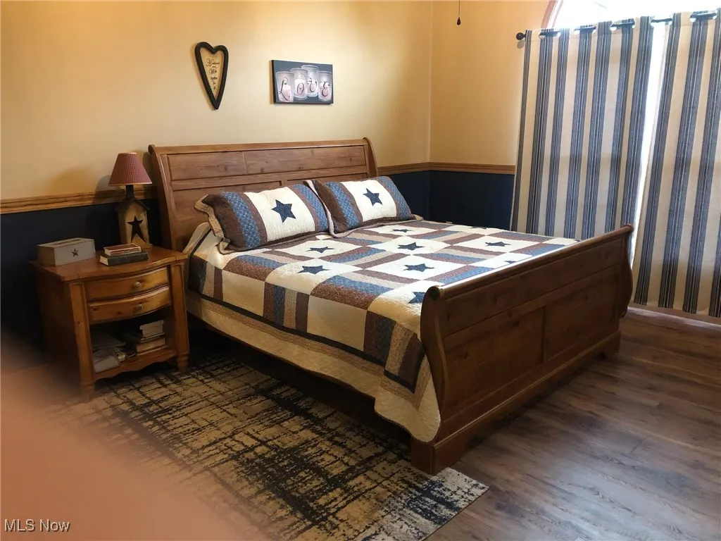 Bedroom featuring wood finished floors