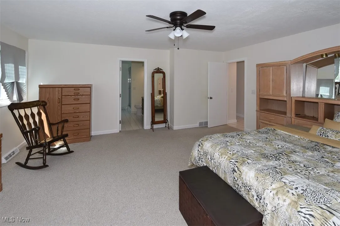 Bedroom featuring carpet and a ceiling fan