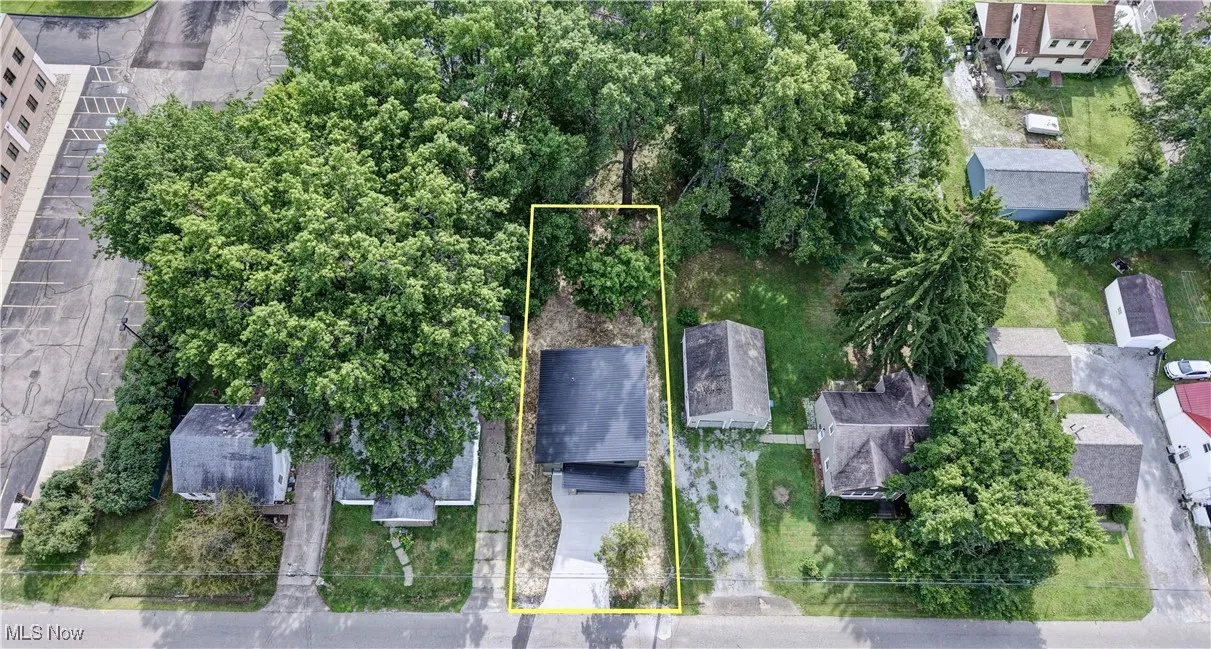 Aerial view of residential area with property parcel outlined