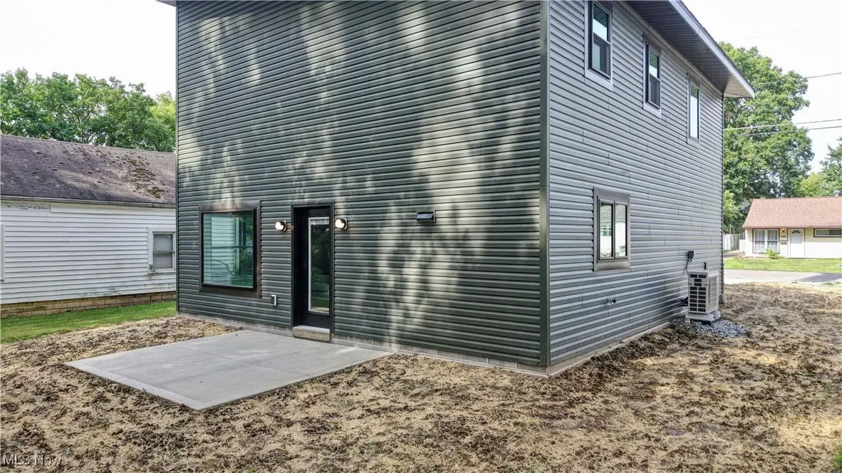 Back of property with a patio area