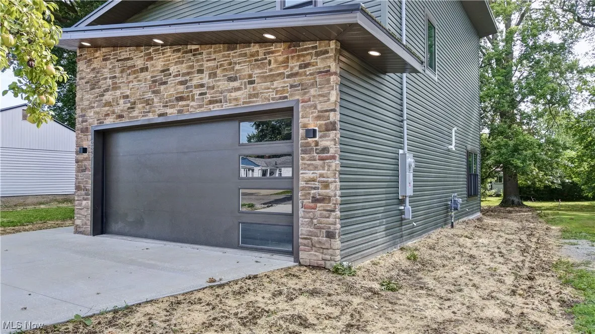 Garage with concrete driveway