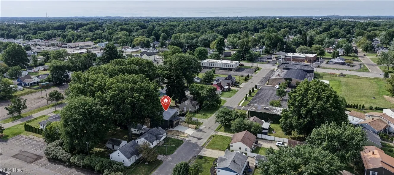 Aerial view of property's location with nearby suburban area