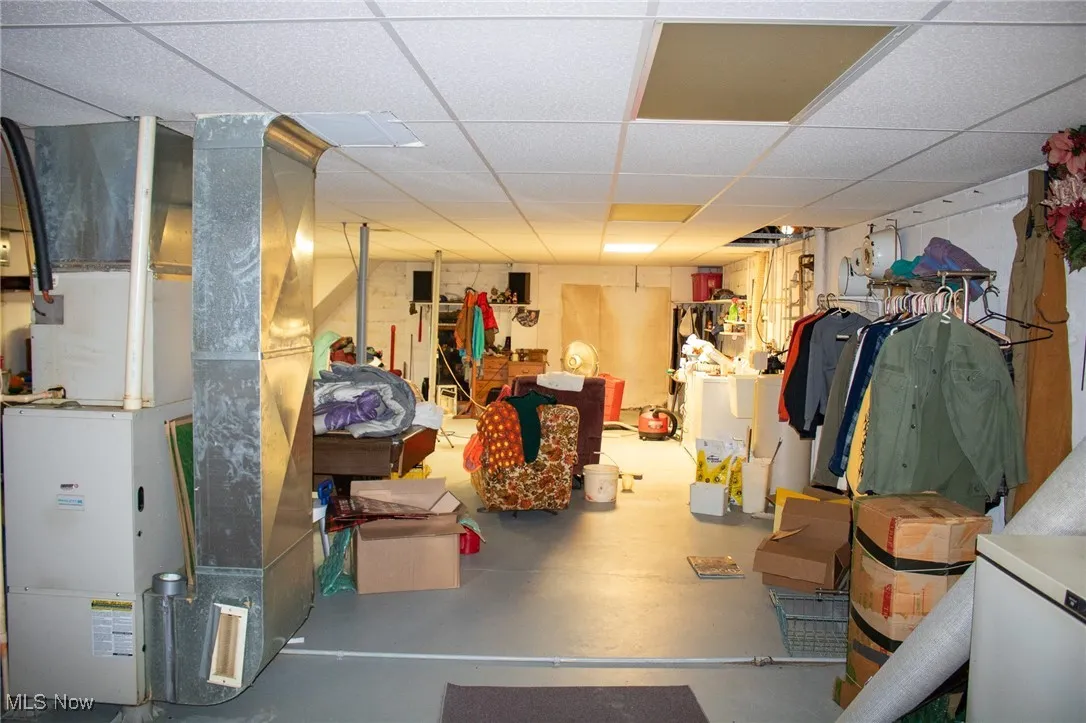 Basement with heating unit and a drop ceiling