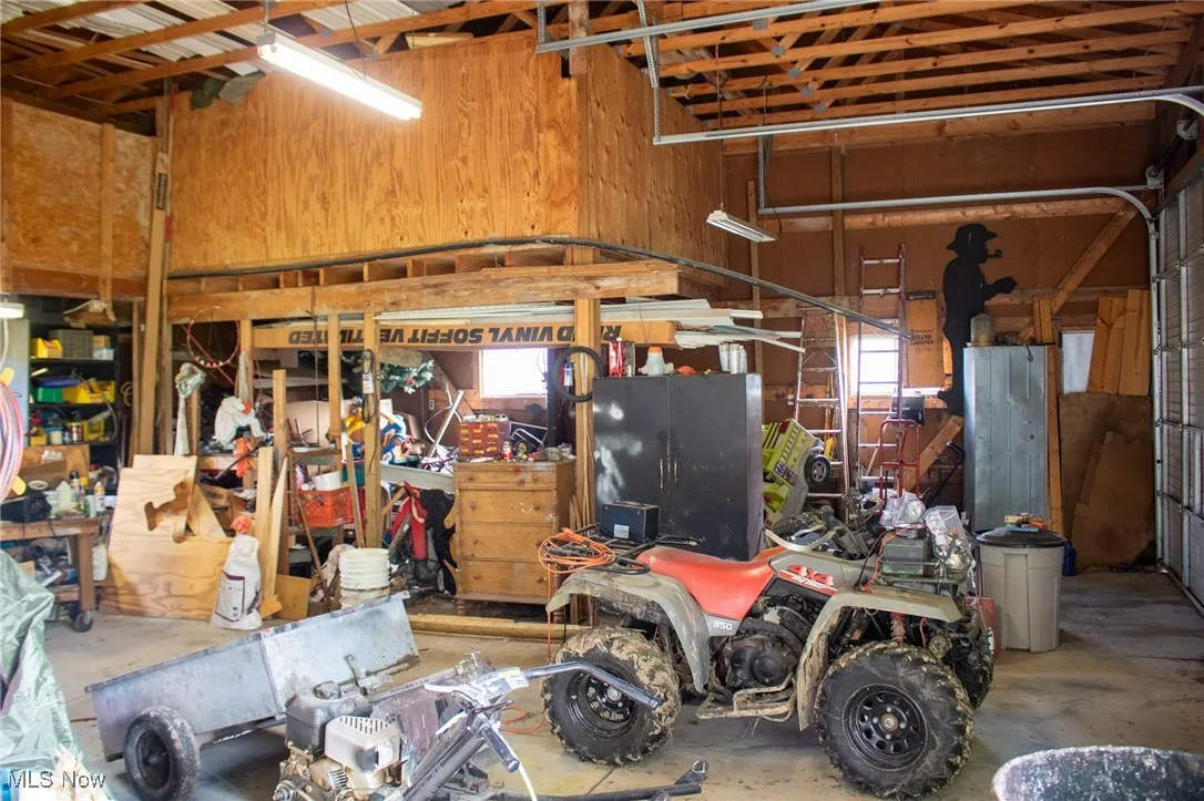 Garage featuring wood walls