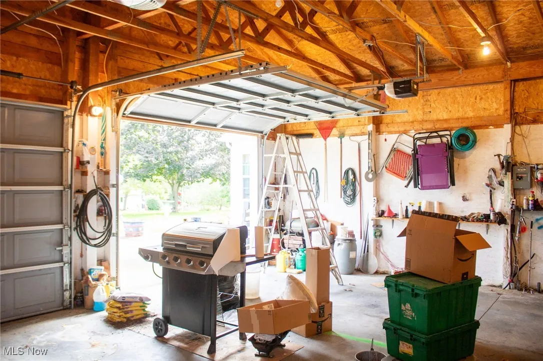 Garage featuring a garage door opener