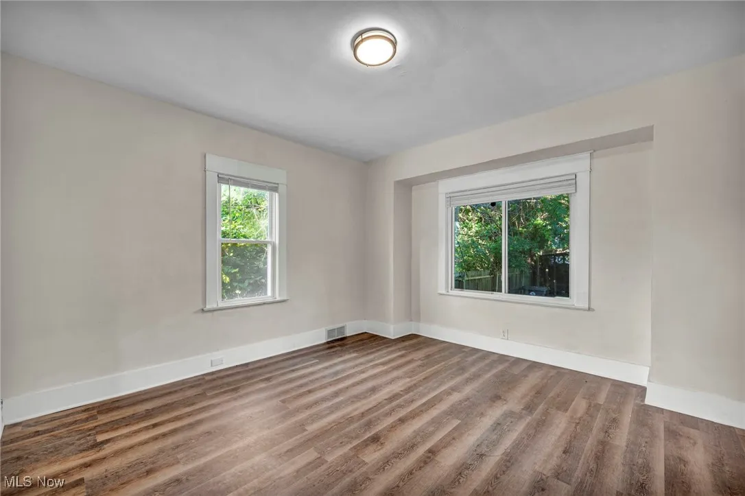 Dining room with plenty of natural light and wood finished floors