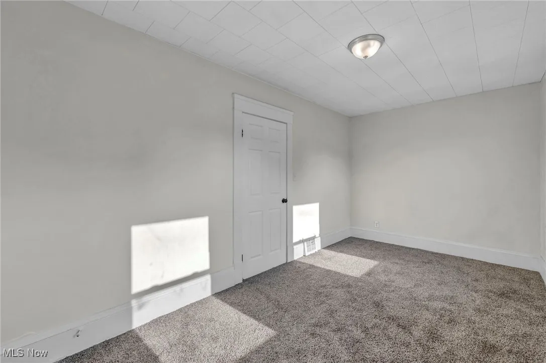 Bedroom with carpet and new windows