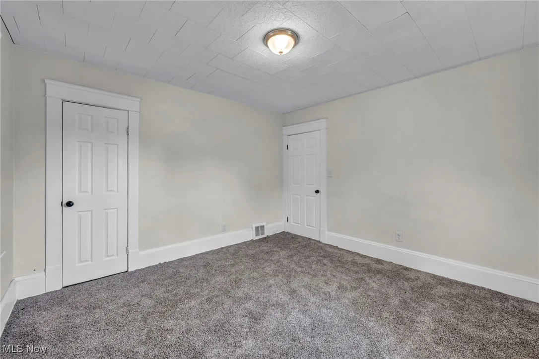 Bedroom with carpet and new windows