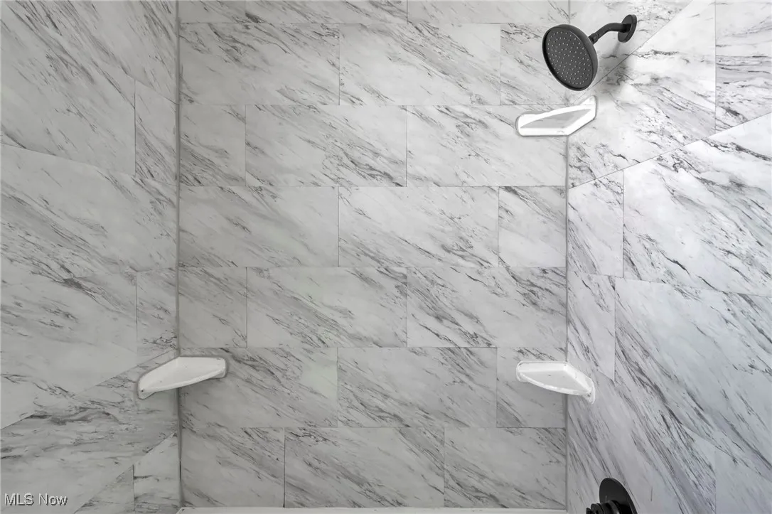Bathroom featuring tiled shower