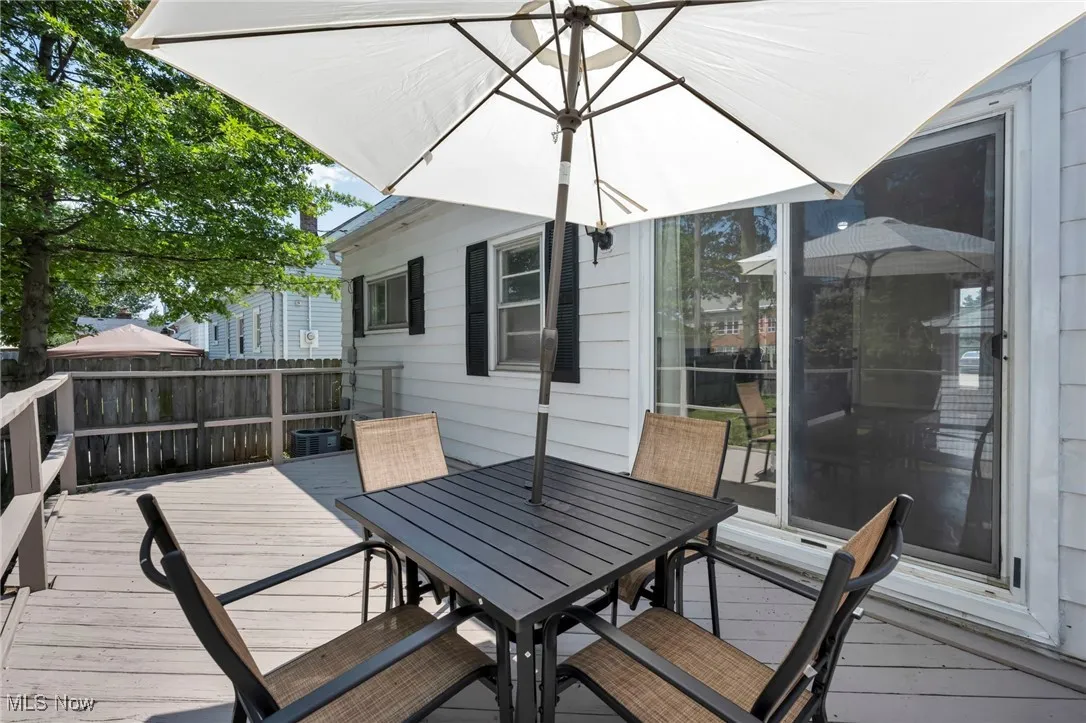 Wooden terrace featuring outdoor dining space
