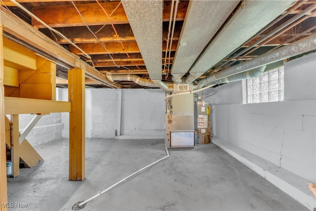 Basement with heating unit and gas water heater