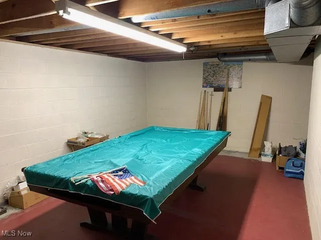 Rec room featuring pool table and concrete flooring