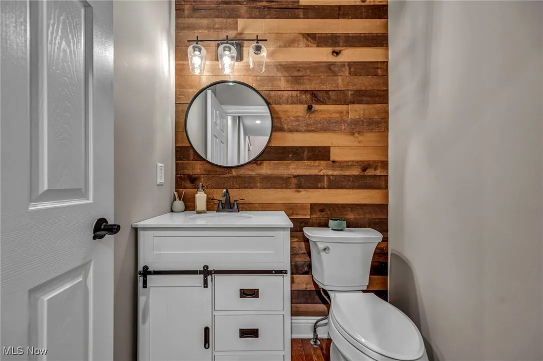 Bathroom with wooden walls and vanity