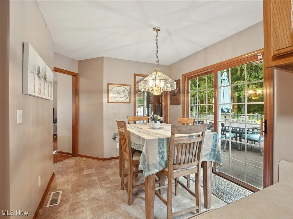 Eating area off kitchen with views of pool area.
