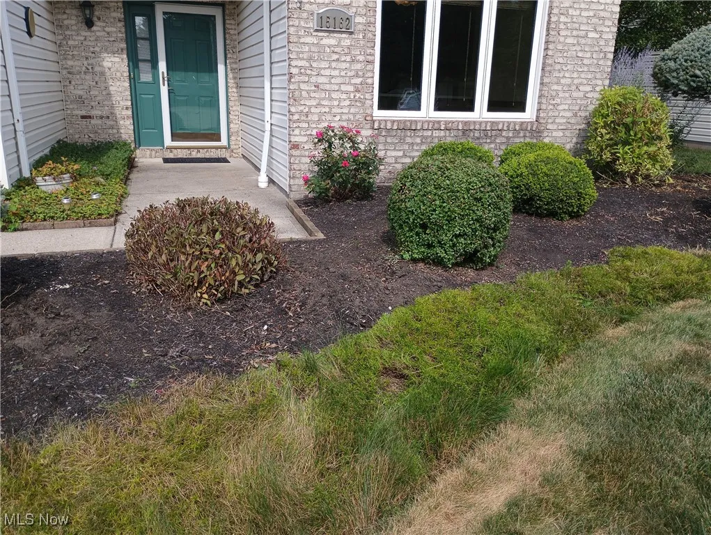 Property entrance with brick siding