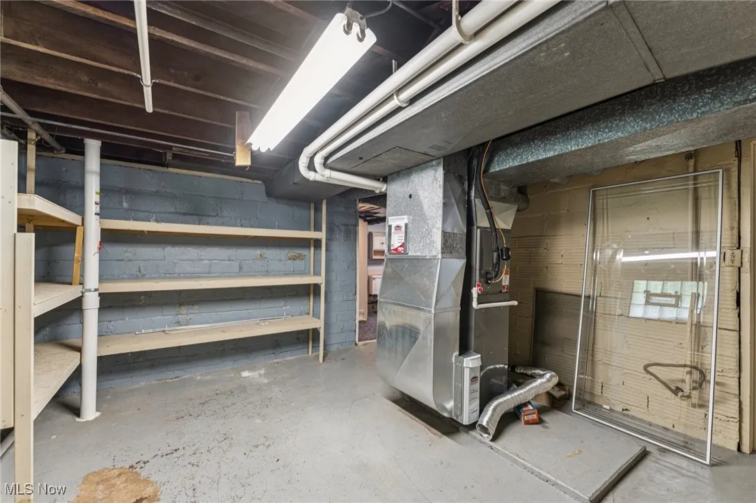 Unfinished basement with heating unit