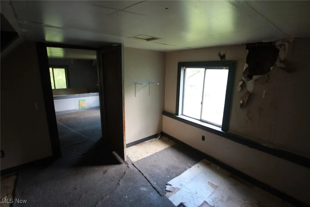Spare room featuring plenty of natural light