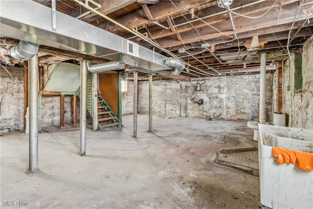 Unfinished basement featuring visible vents