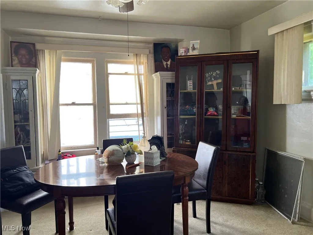 Dining space with light colored carpet