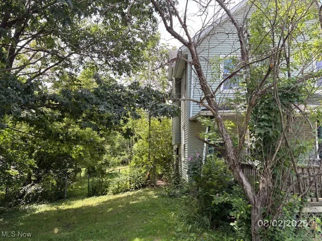 View of home's exterior featuring a lawn