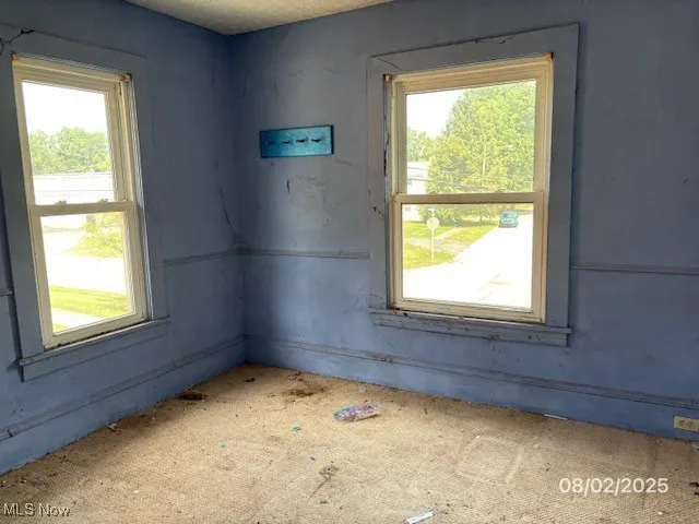 Empty room featuring healthy amount of natural light