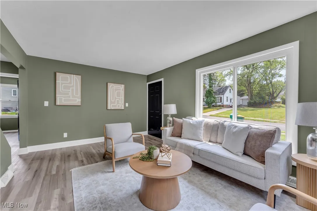 Living area with plenty of natural light and wood finished floors
