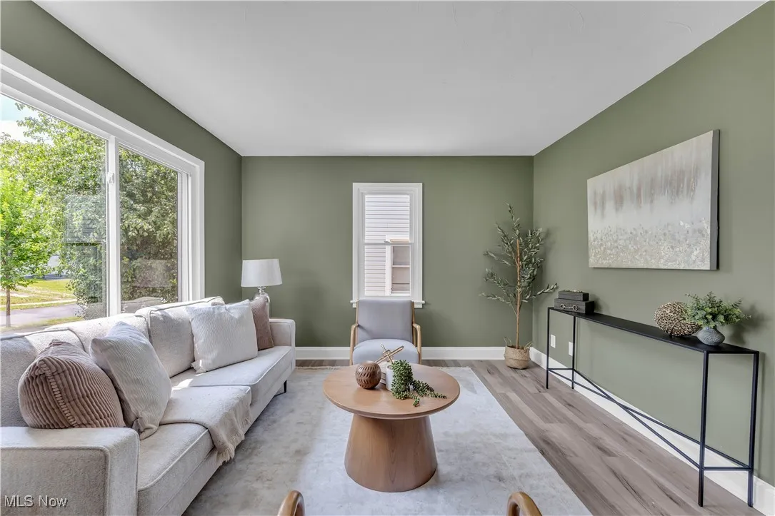 Living room featuring wood finished floors and baseboards