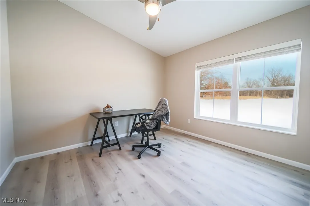 Office space featuring wood finished floors and a ceiling fan