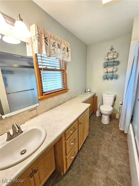 Bathroom with toilet and vanity