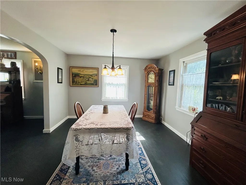 Dining room featuring arched walkways