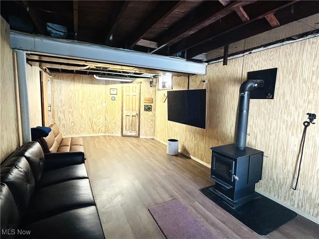 Recreation room featuring a wood stove