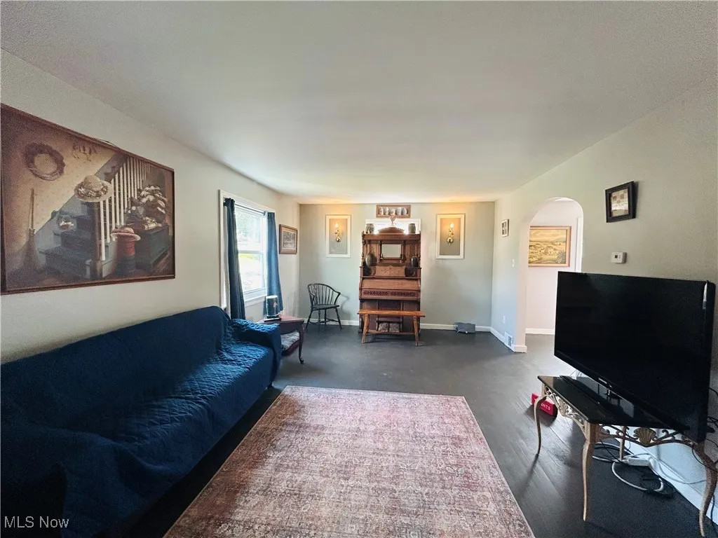 Living area featuring arched walkways