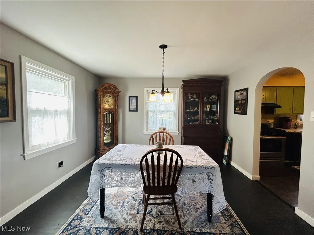 Dining room featuring arched walkways